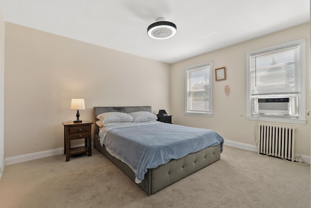 104 W 52nd St, Bayonne, NJ 07002 - bedroom with radiator, cooling unit, and carpet floors