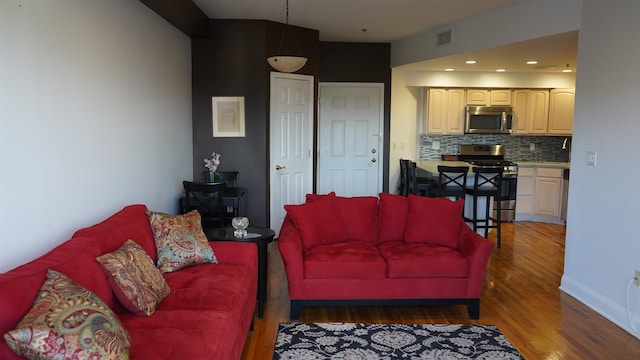 living room with dark hardwood / wood-style floors