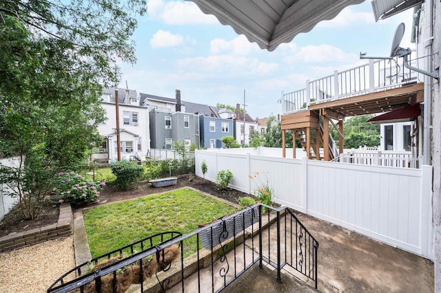 27 48th St, Weehawken, NJ 07086 - fenced backyard with stairs, a deck, and a residential view