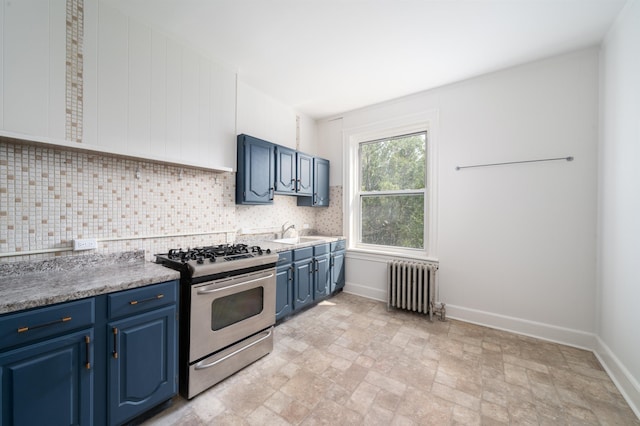 27 48th St, Weehawken, NJ 07086 - kitchen with radiator, stainless steel gas range oven, blue cabinetry, backsplash, and stone finish flooring