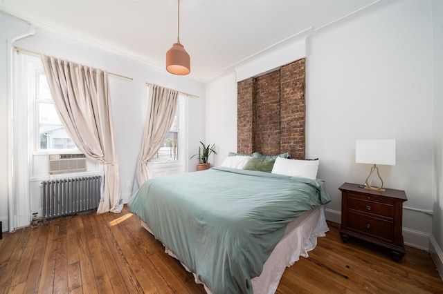 27 48th St, Weehawken, NJ 07086 - bedroom with radiator heating unit, wood-type flooring, and cooling unit