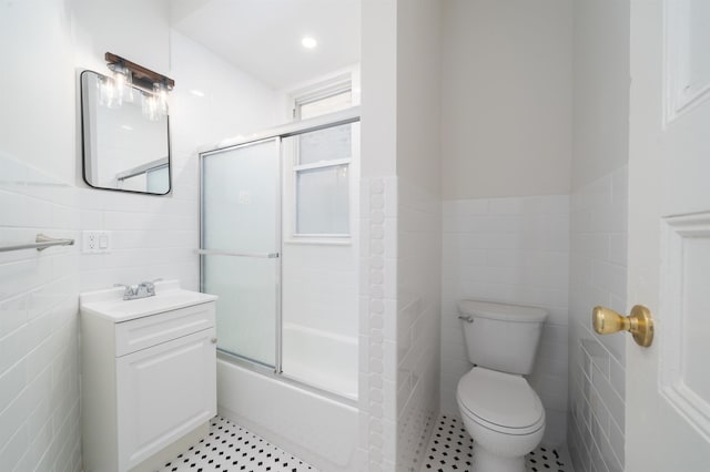 27 48th St, Weehawken, NJ 07086 - full bath with tile walls, vanity, enclosed tub / shower combo, and wainscoting