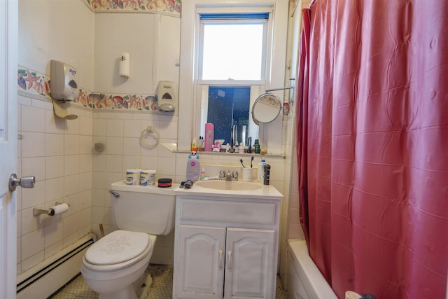 full bathroom featuring shower / tub combo with curtain, toilet, tile walls, baseboard heating, and vanity