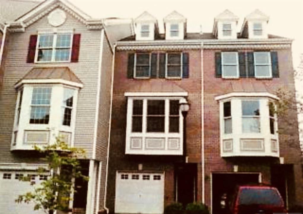 view of property featuring an attached garage
