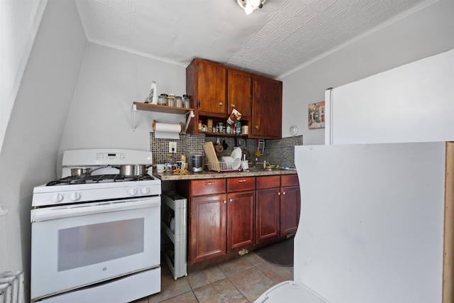 kitchen featuring dark brown cabinets, backsplash, open shelves, gas range gas stove, and an ornate ceiling