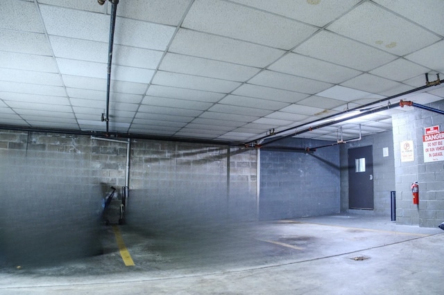 basement featuring a paneled ceiling