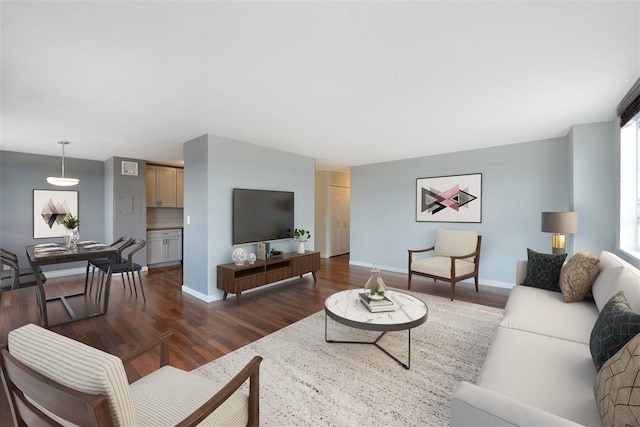 100 Manhattan Ave Unit 205, Union City, NJ 07087 - living room with dark wood-style floors, baseboards, and healthy amount of natural light