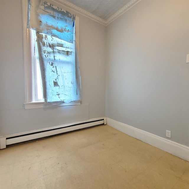 spare room with a baseboard heating unit, light floors, crown molding, and baseboards