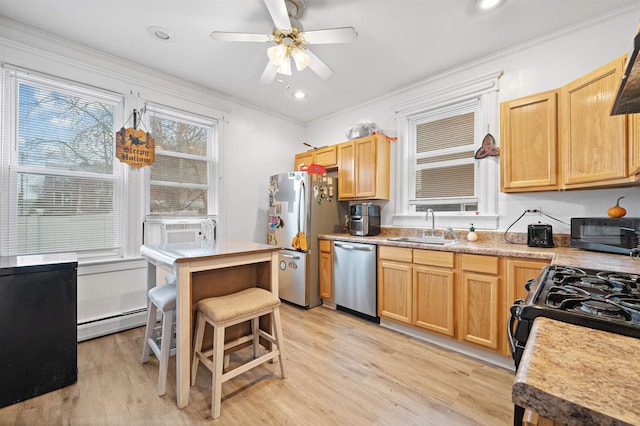 kitchen with stainless steel appliances, a baseboard radiator, light countertops, ornamental molding, and a sink