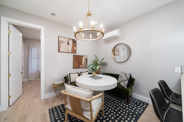 dining space with light wood finished floors, a wall unit AC, and baseboards