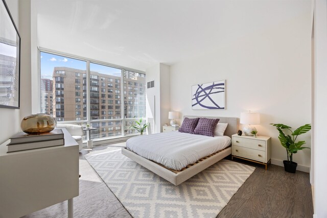20 Newport Pkwy Unit 1707, Jersey City, NJ 07310 - bedroom with wood finished floors, floor to ceiling windows, and a city view