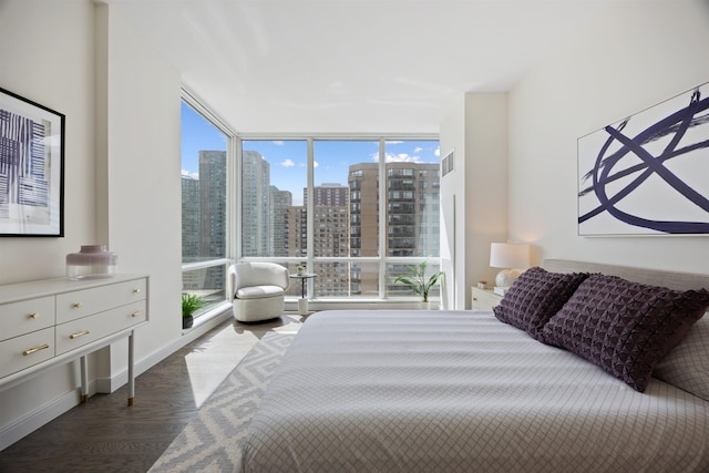 20 Newport Pkwy Unit 1707, Jersey City, NJ 07310 - bedroom with a wall of windows, wood finished floors, and a skyline view