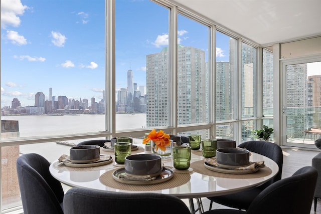 20 Newport Pkwy Unit 1707, Jersey City, NJ 07310 - dining space with a view of skyline and a wall of windows