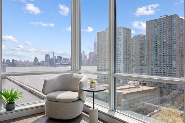 20 Newport Pkwy Unit 1707, Jersey City, NJ 07310 - sitting room with a skyline view, plenty of natural light, and wood finished floors