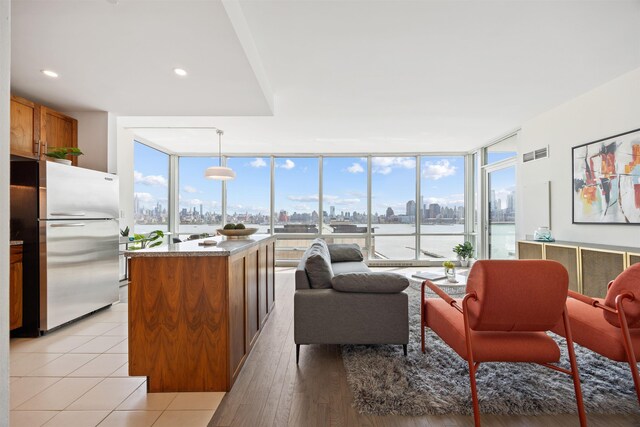 20 Newport Pkwy Unit 1707, Jersey City, NJ 07310 - living room featuring a skyline view, expansive windows, and plenty of natural light