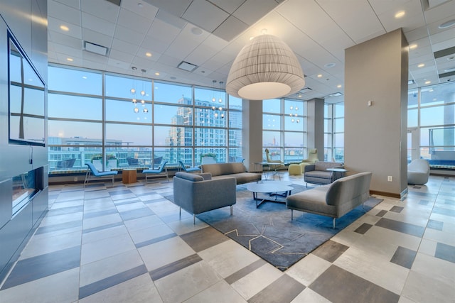 20 Newport Pkwy Unit 1707, Jersey City, NJ 07310 - community lobby with expansive windows, a high ceiling, a view of city, and a paneled ceiling