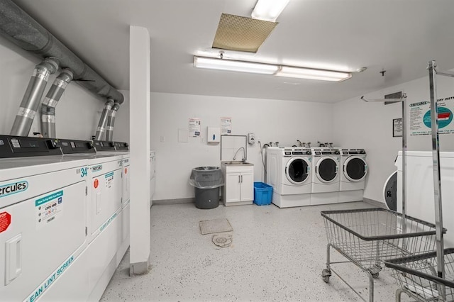 187 Wayne St Unit 106C, Jersey City, NJ 07302 - community laundry room featuring washing machine and dryer and baseboards