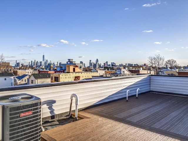 wooden deck featuring central air condition unit