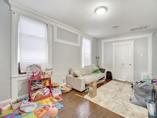 playroom featuring dark hardwood / wood-style floors