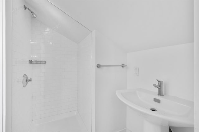 65 Dillingham Pl, Englewood Cliffs, NJ 07632 - bathroom with a shower stall, vaulted ceiling, and a sink