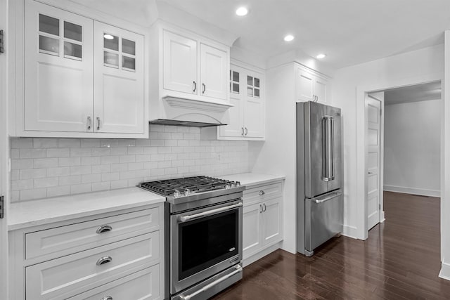 65 Dillingham Pl, Englewood Cliffs, NJ 07632 - kitchen with glass insert cabinets, dark wood-type flooring, white cabinets, stainless steel appliances, and custom range hood