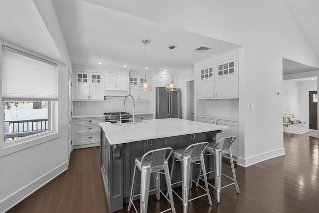 65 Dillingham Pl, Englewood Cliffs, NJ 07632 - kitchen featuring white cabinetry, baseboards, high quality fridge, and visible vents