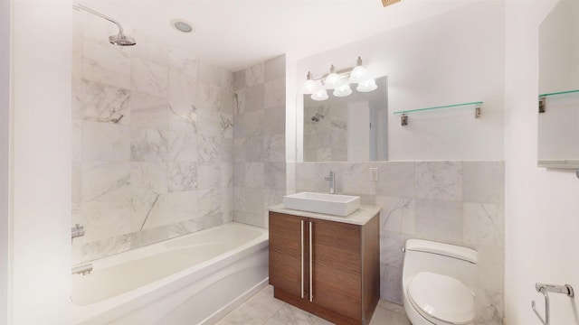 bathroom featuring tile walls, shower / bathtub combination, vanity, and toilet