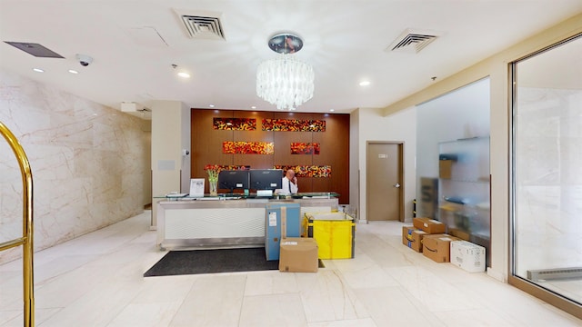 reception area featuring an inviting chandelier and visible vents