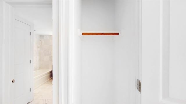 full bath featuring a washtub and marble finish floor