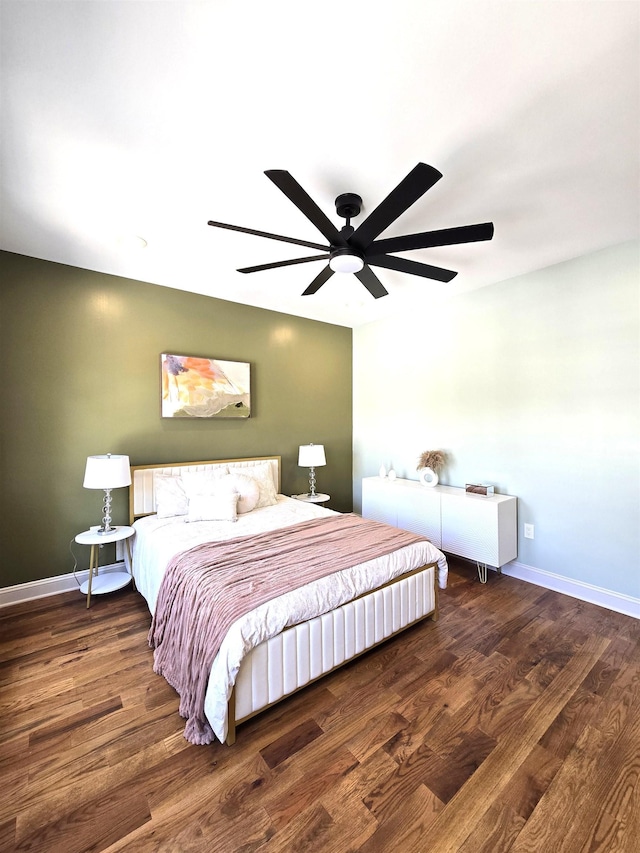 bedroom featuring baseboards, a ceiling fan, and wood finished floors
