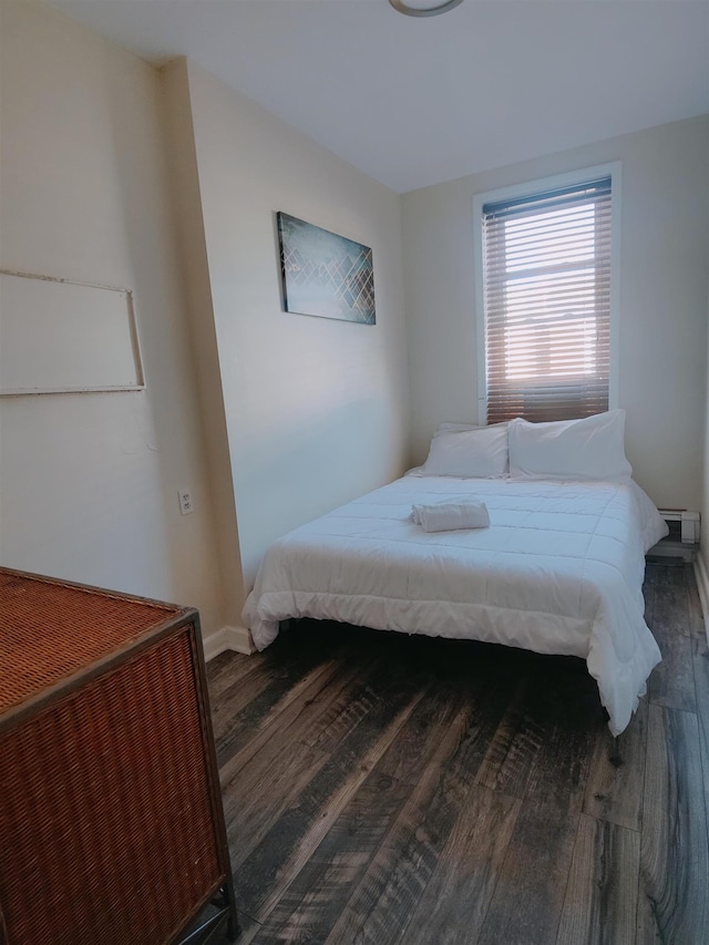 bedroom featuring dark hardwood / wood-style floors