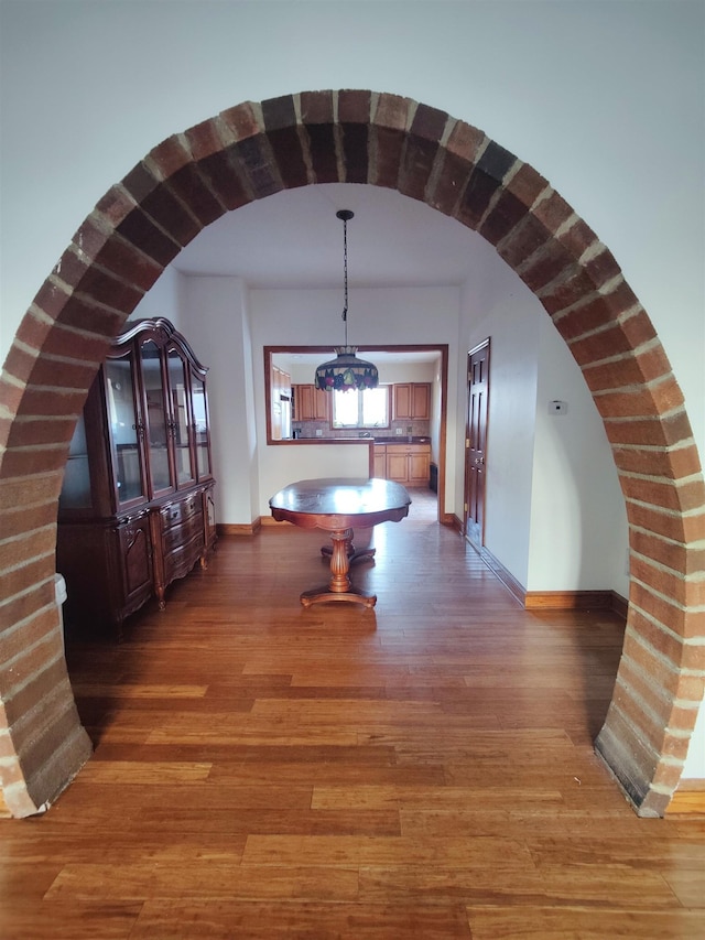 hallway featuring dark hardwood / wood-style flooring