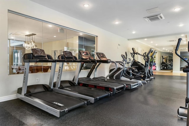 workout area featuring baseboards and recessed lighting