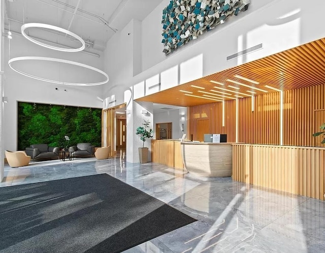 welcome area featuring a towering ceiling