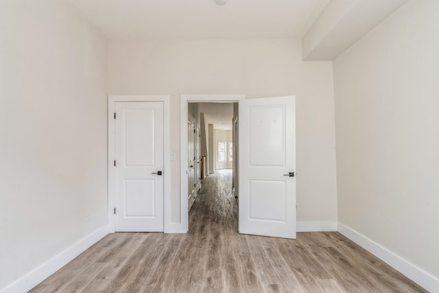 spare room featuring light wood-type flooring