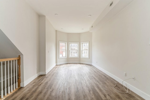 unfurnished living room featuring hardwood / wood-style flooring