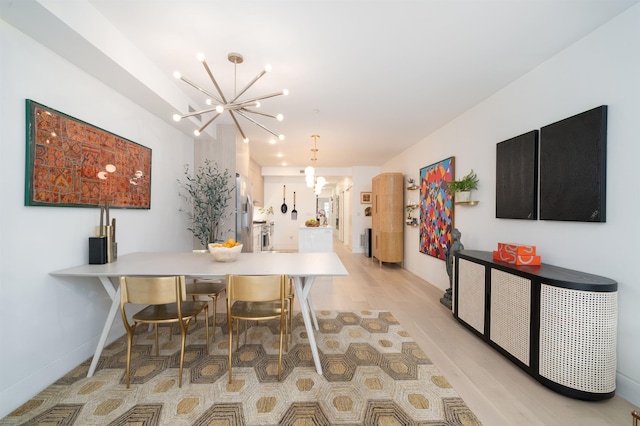 415 Monmouth St Apt. Three, Apt Three, Jersey City, NJ 07302 - dining area featuring a chandelier and light wood-style floors