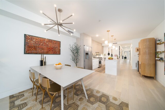 415 Monmouth St Apt. Three, Apt Three, Jersey City, NJ 07302 - dining room with a chandelier, light wood-type flooring, and recessed lighting
