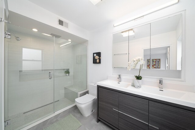 415 Monmouth St Apt. Three, Apt Three, Jersey City, NJ 07302 - bathroom with double vanity, a stall shower, and tile patterned floors