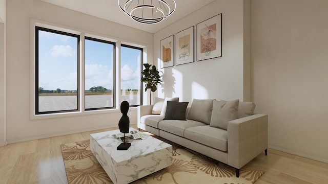 living room featuring an inviting chandelier and light wood-type flooring