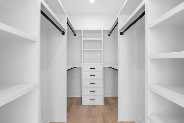 walk in closet featuring light wood-style flooring