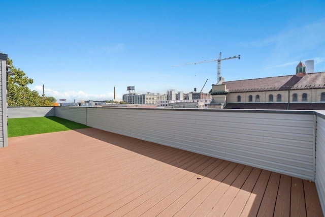 wooden terrace featuring a view of city