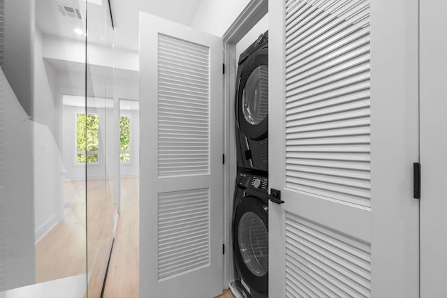 interior space featuring visible vents and stacked washer / drying machine