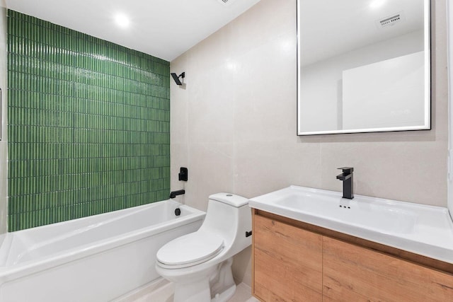 full bath featuring visible vents, toilet, vanity, tile walls, and shower / bathing tub combination