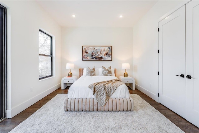 bedroom featuring recessed lighting, baseboards, and dark wood-style floors