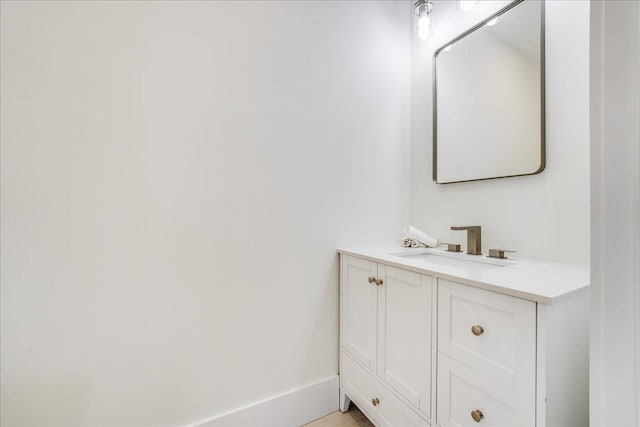 bathroom featuring vanity and baseboards