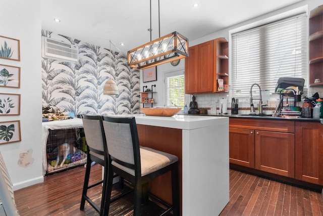 310 28th St, Union City, NJ 07087 - kitchen featuring open shelves, a sink, wallpapered walls, brown cabinets, and dark wood finished floors