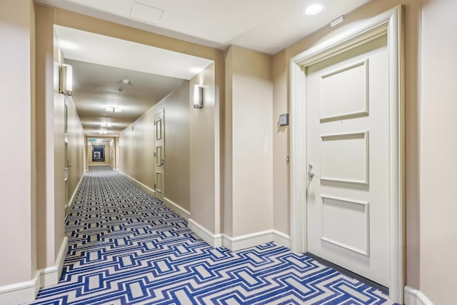 hall with carpet floors