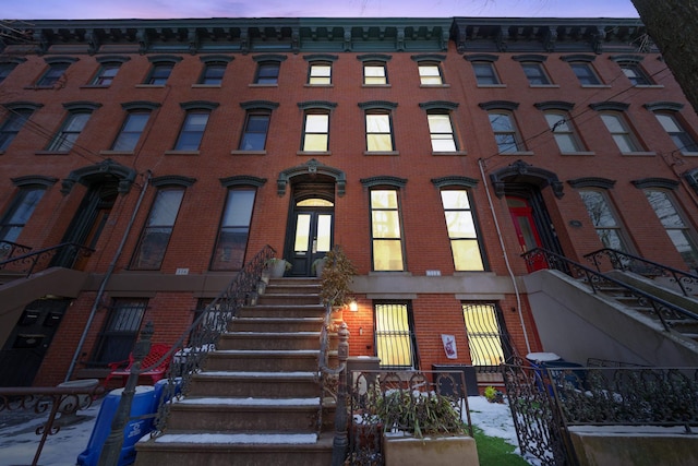 view of outdoor building at dusk