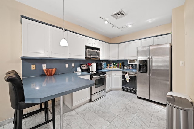 kitchen featuring visible vents, white cabinets, a peninsula, marble finish floor, and stainless steel appliances